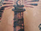Lighthouse tattoo neo traditional black grey tattooed men 